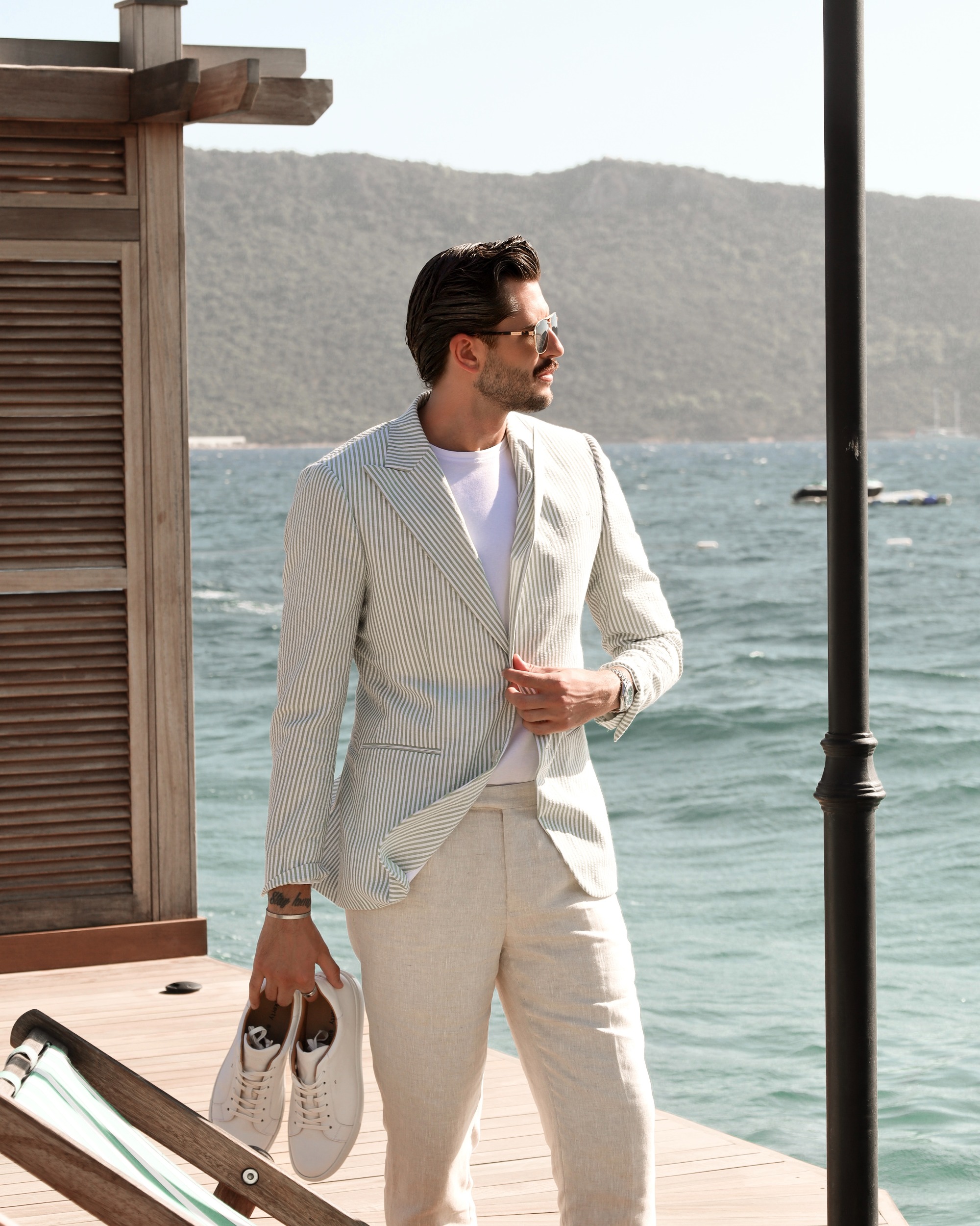 Tailor adjusting cuffs during a fitting